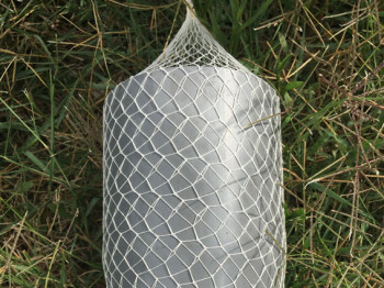 Cotton net of an elongated oval shape
